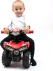 A baby sitting on a red toy quad. Anteprima dell’immagine prodotto