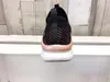 The back view of a sneaker is shown resting on a white shelf against a light wood-paneled background. Náhled obrázku produktu