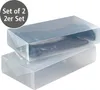 Two transparent shoe boxes are stacked on top of each other, with boots inside the top box. Produktbild-Vorschau