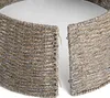 A close-up view of a woven Christmas tree skirt, showing its texture and how it opens in the middle. Produktbild-Vorschau