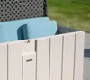 Close-up of a light gray outdoor storage box with light blue cushions inside. Podgląd zdjęcia produktu