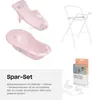 A collage of images showing a pink baby bathtub, a baby bathtub seat, a white metal stand for the bathtub, and a box with accessories for the bathtub. Náhľad obrázku produktu