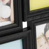 A close-up view of a black multi-photo frame, showing parts of several frames and photographs. Náhľad obrázku produktu