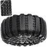 A close-up view of a tire with snow chains attached, showing different tread patterns. Anteprima dell’immagine prodotto