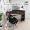 A computer desk setup in a room with a computer, chair, and plant. Náhled obrázku produktu