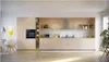 A modern, minimalist kitchen with light wood cabinets and a black oven. Náhľad obrázku produktu