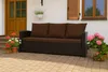 A brown sofa with cushions on a patio with potted plants. Produktbild-Vorschau