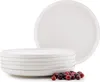 A stack of white ceramic plates with a few cranberries in the foreground. Náhled obrázku produktu