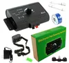 A collection of items for an electronic pet fencing system, including the main transmitter unit, a collar, power adapter, wire, and packaging. Produktbild-Vorschau