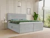 A bedroom scene with a bed, nightstand, and a large window overlooking a forest. Produktbild-Vorschau