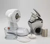 A white and silver electric grater with its attachments laid out on a white background. Podgląd zdjęcia produktu