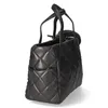 A black quilted handbag is shown from the side against a white background. Náhľad obrázku produktu