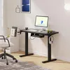 A modern home office setup with a standing desk, computer, and chair. Voir les images du produit