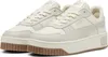A pair of beige Puma sneakers with brown soles. Produktbild-Vorschau