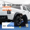 A person is working on a white pickup truck with blue interlocking garage floor tiles in the foreground. Anteprima dell’immagine prodotto