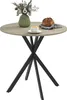 A round dining table with a vase of flowers, a cup of coffee, and a loaf of bread on it. Produktbild-Vorschau