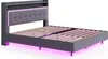 A grey upholstered bed frame with a headboard featuring LED lighting and a shelf, shown from a diagonal angle. Náhľad obrázku produktu