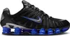 A side view of a black Nike Shox TL sneaker with blue accents. Anteprima dell’immagine prodotto