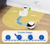 A robot vacuum cleaner is shown on a yellow mat with charging station and a diagram illustrating its "Tumbler Design". Náhled obrázku produktu