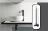 A bathroom sink with a black faucet and a black flexible hose connector shown in an inset. Anteprima dell’immagine prodotto