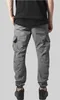 Back view of a person wearing grey cargo jogging pants. Produktbild-Vorschau