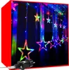A string of colorful star-shaped lights hanging in front of a dark background, with a red border framing the image. Náhled obrázku produktu