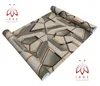 A roll of wallpaper with a geometric pattern is shown on a white background. Anteprima dell’immagine prodotto