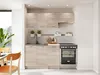 A modern, compact kitchen setup with light wood cabinets and beige accents, featuring a sink, stove, and overhead storage. Náhľad obrázku produktu