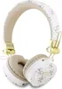 A pair of white and gold GUESS headphones with a patterned design. Voir les images du produit