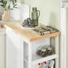 A close-up view of a white kitchen cart with a wooden top, displaying kitchenware and pantry items. Produktbild-Vorschau