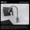 A kitchen faucet is shown on a countertop next to a sink, with a moka pot and a microwave in the background. Produktbild-Vorschau