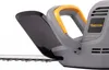 Close-up of a hedge trimmer's handle and blade guard. Náhled obrázku produktu