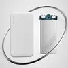 A white Wozinsky power bank and its internal components are displayed against a light gray and white background, framed by a silver metallic loop. Náhľad obrázku produktu