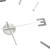 A close-up of a modern 3D wall clock with silver hands and hour markers. Náhľad obrázku produktu