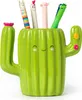 A green ceramic cactus-shaped pen holder filled with colorful pens. Voir les images du produit