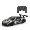 A remote-controlled Porsche 911 GT2 RS Clubsport 25 car and its remote control are displayed against a white background. Podgląd zdjęcia produktu