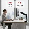 A woman is working at a desk with a monitor mounted on an adjustable arm. Anteprima dell’immagine prodotto