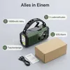 A green emergency radio with solar panel and flashlight is displayed with accompanying accessories and packaging, along with feature callouts. Produktbild-Vorschau