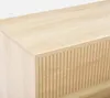 A close-up view of a wooden sideboard with a ribbed drawer front. Produktbild-Vorschau