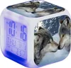 A digital alarm clock with a wolf motif, displaying the time, day, month, date, and temperature. The clock is illuminated with blue light at the bottom. Produktbild-Vorschau