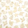 A collection of wooden Christmas ornaments scattered on a white background. Produktbild-Vorschau