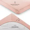 Close-up views of a pink fitted sheet, highlighting its features. Produktbild-Vorschau