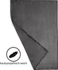 A folded dark gray blanket is shown with a feather icon and text indicating it is skin-friendly and soft. Produktbild-Vorschau
