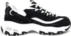 A studio shot of a single black and white sneaker. Náhled obrázku produktu