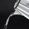 Water being poured from a kettle spout. Produktbild-Vorschau