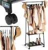 A black metal garment rack with clothes, hats, and shoes on display, with a close-up of a wheel and a logo in the upper left corner. Anteprima dell’immagine prodotto