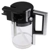 A clear plastic and black milk carafe with a silver handle. Produktbild-Vorschau
