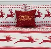 Christmas-themed bedding with reindeer and snowflake patterns, featuring a decorative pillow with "Merry Christmas" text. Podgląd zdjęcia produktu