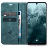A teal flip case for a smartphone is open, revealing card slots and a banknote. The smartphone screen is on. Produktbild-Vorschau