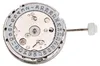 A close-up view of a watch movement with a date complication. Náhled obrázku produktu